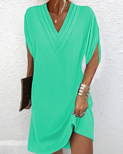 Robe élégante à manches fendues de couleur unie