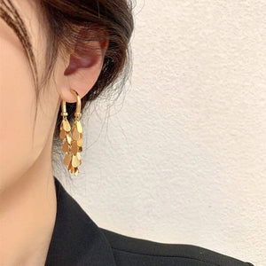 Boucles d'oreilles pompons à sequins